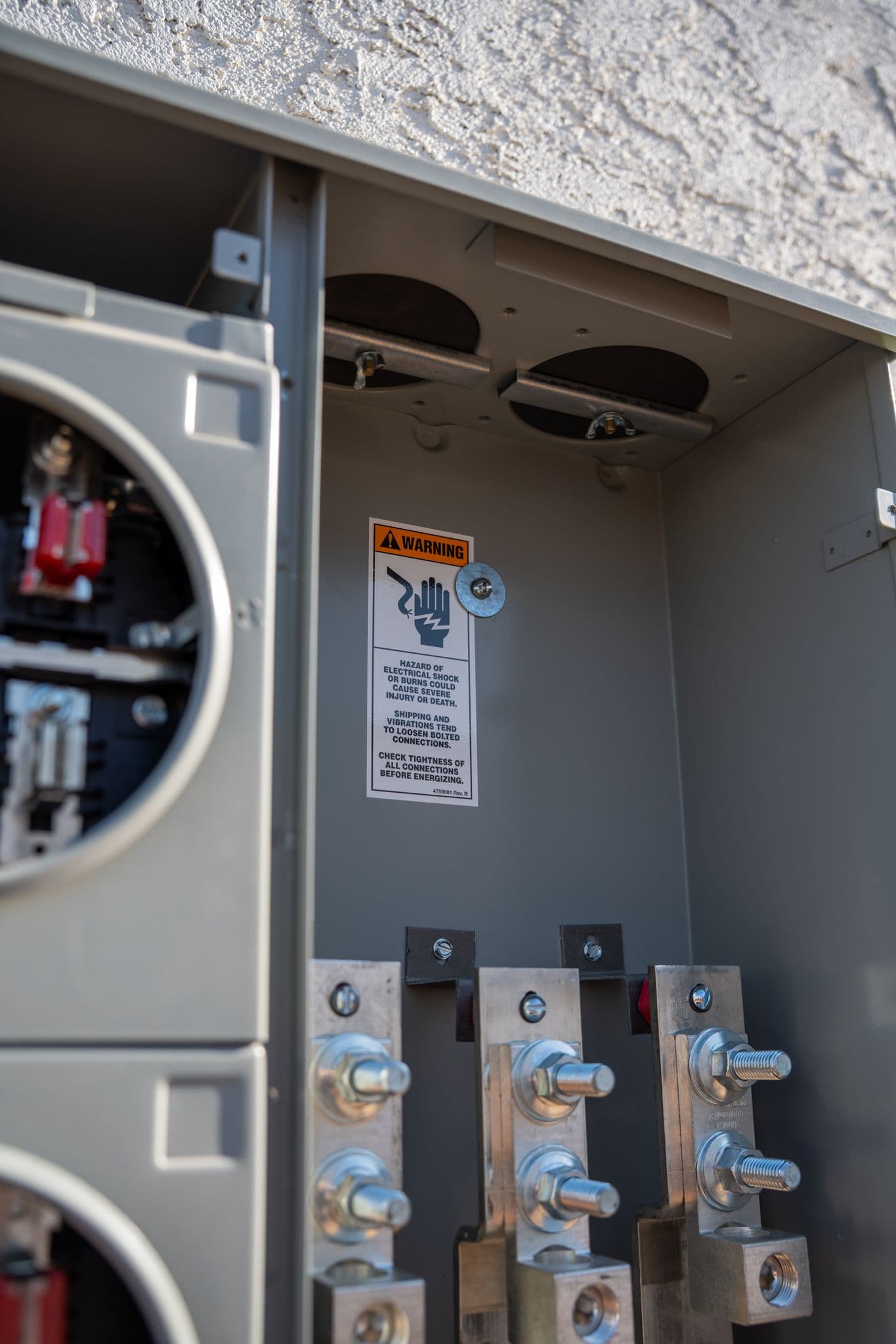 A new meter socket and lugs with the warning label